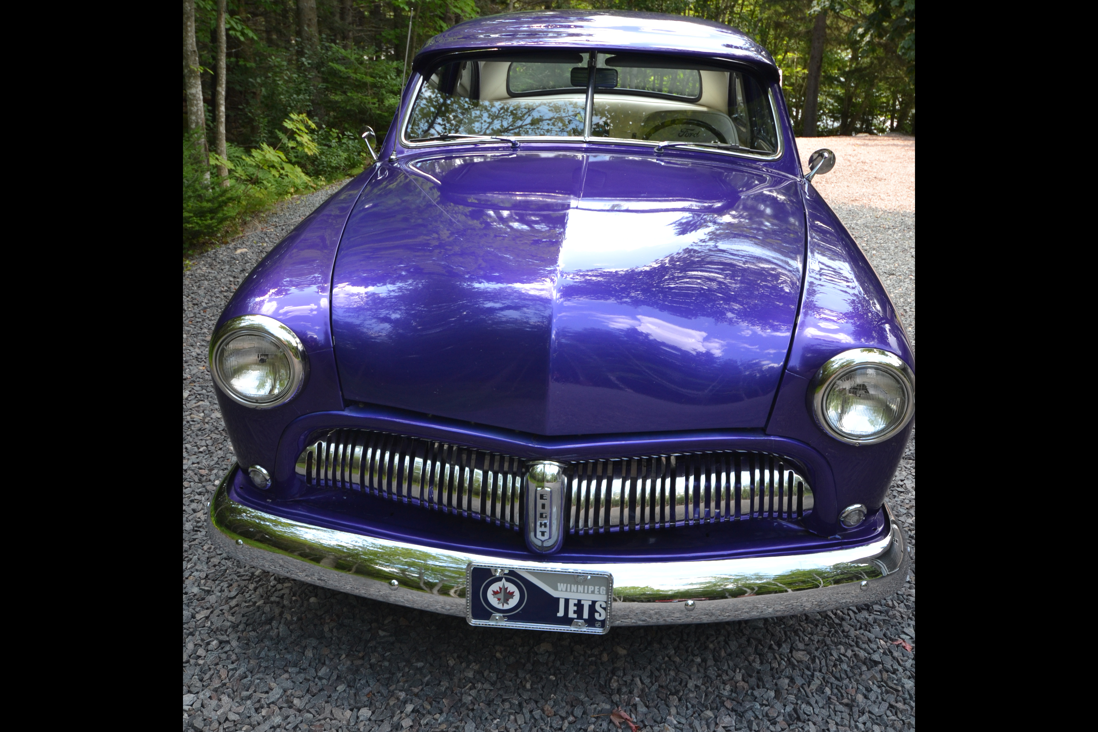 Front perspective of the purple 1950 Ford Coupe